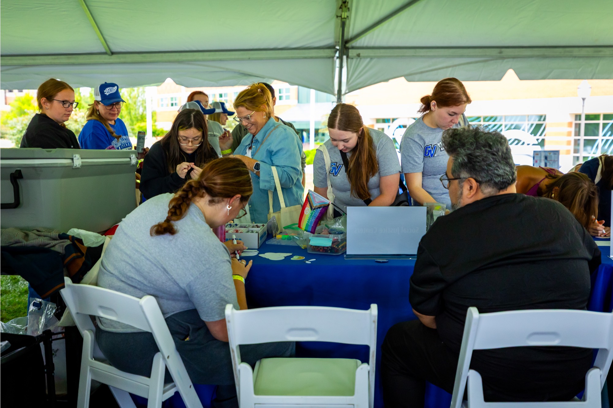 Families crafting under a tent
